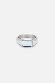 Signet ring with a white iridescent inlay, front view