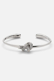 Silver-tone textured knot cuff bracelet, front view on a light background