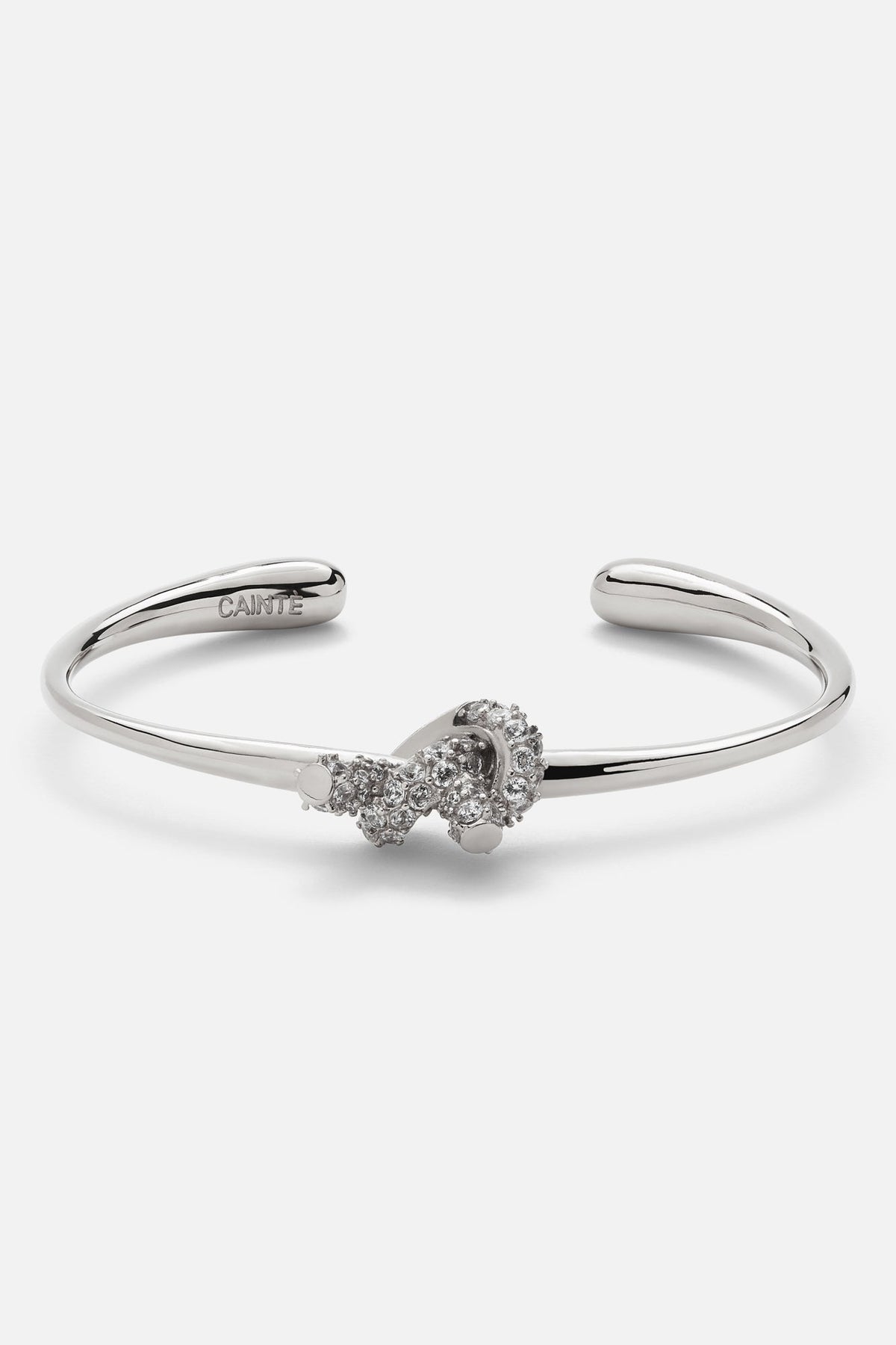 Silver-tone textured knot cuff bracelet, front view on a light background