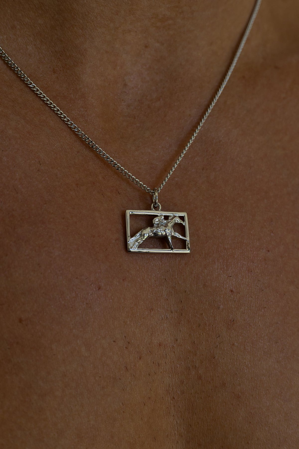 Silver-tone necklace with a rectangular horse and rider plaque, view 4 of 8