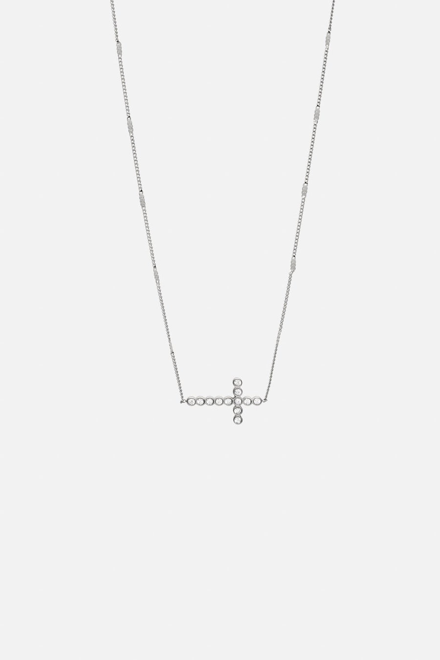 Silver-tone sideways cross necklace, front view on a light background