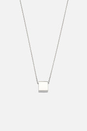 Silver-tone cube pendant necklace, front view on a light background