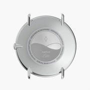 Rear view of the silver-tone case with an engraved center plate.