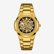 Gold-tone rounded octagon skeleton watch on a gold-tone bracelet