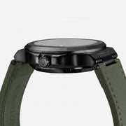 Side profile of the black case and green strap
