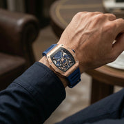Rose gold-tone skeleton watch on the wrist