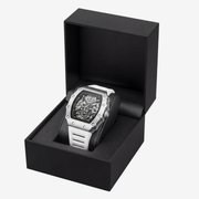 Skeleton watch with white strap in an open black presentation box