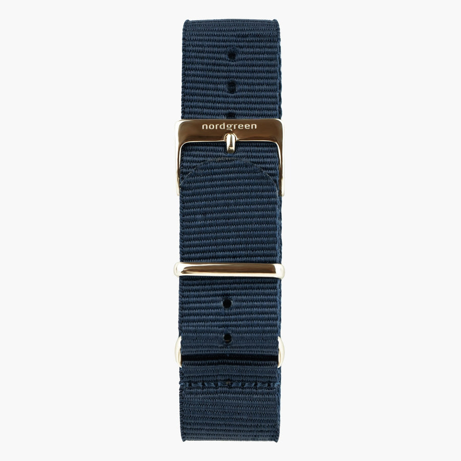 Navy nylon strap with a warm rose gold-tone buckle and keeper rings.
