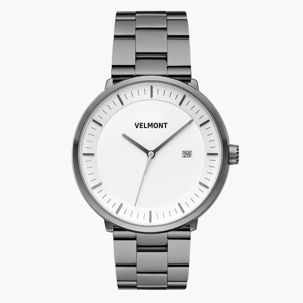Gunmetal watch with a white dial and date window on a matching link bracelet.