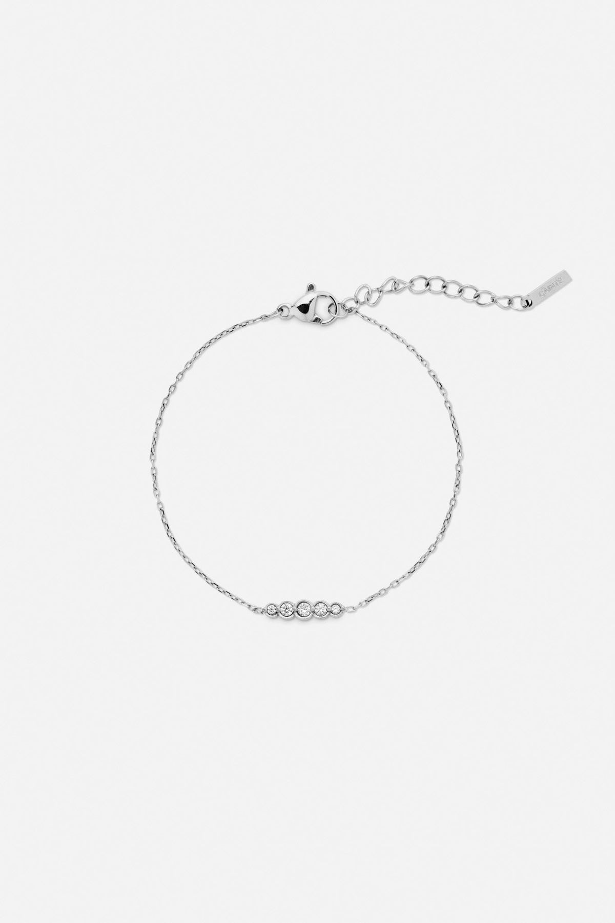 Silver-tone fine station bracelet, front view on a light background