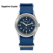 Blue-dial military watch on a blue strap labeled Sapphire Crystal
