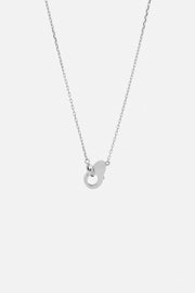 Silver-tone charm necklace, front view on a light background