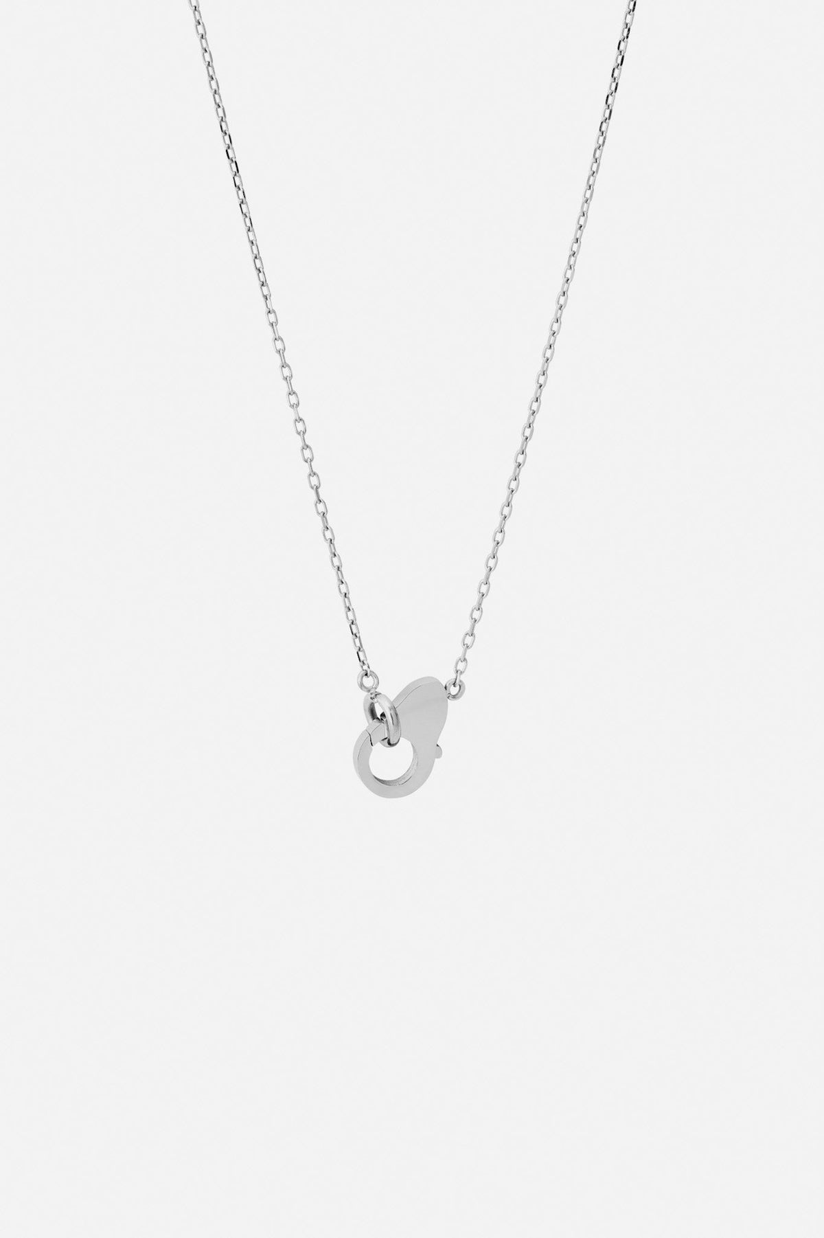 Silver-tone charm necklace, front view on a light background