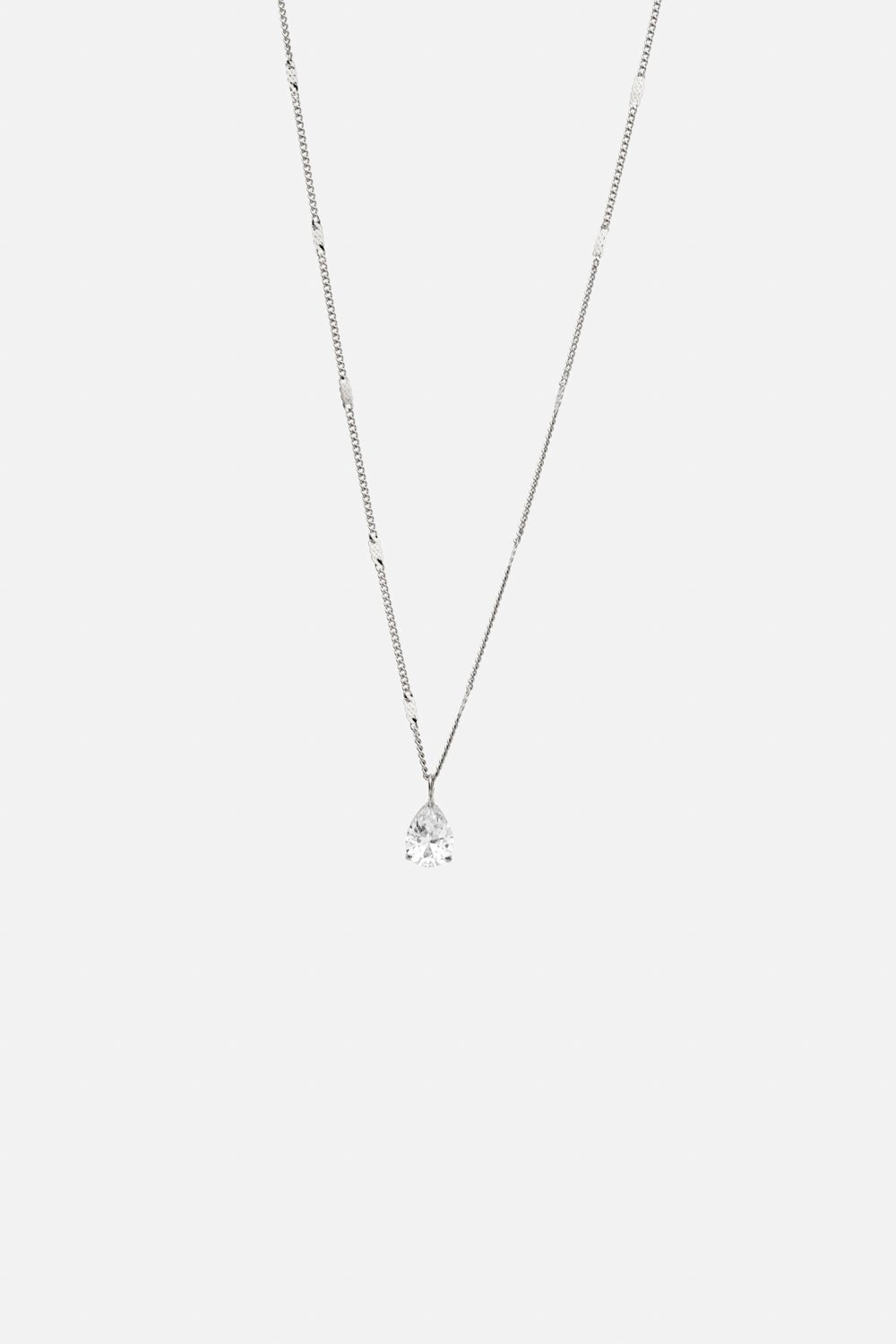 Silver-tone dainty pendant necklace, front view on a light background