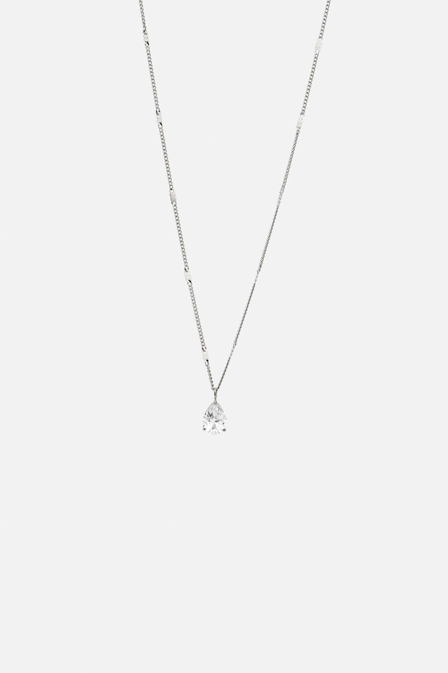 Silver-tone dainty pendant necklace, front view on a light background