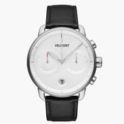 Chronograph-style watch with a white dial and silver-tone case on a black strap.