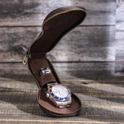 Upright open pouch holding a watch