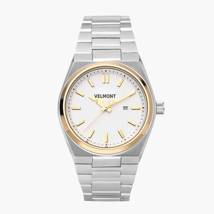 Two-tone watch with a gold-tone bezel, white dial and silver-tone integrated bracelet.