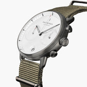 Angled view of the gunmetal case with pushers and an olive green band.