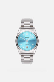 Front view of the round watch with turquoise sunburst dial and date window