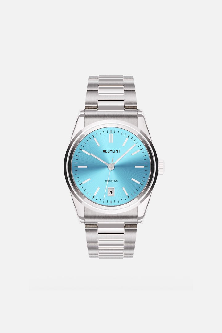 Front view of the round watch with turquoise sunburst dial and date window