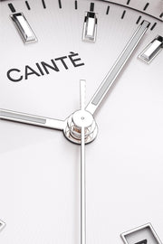 Close-up of the white sunburst dial, baton markers and hands