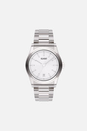 Front view of the round watch with white sunburst dial and date window