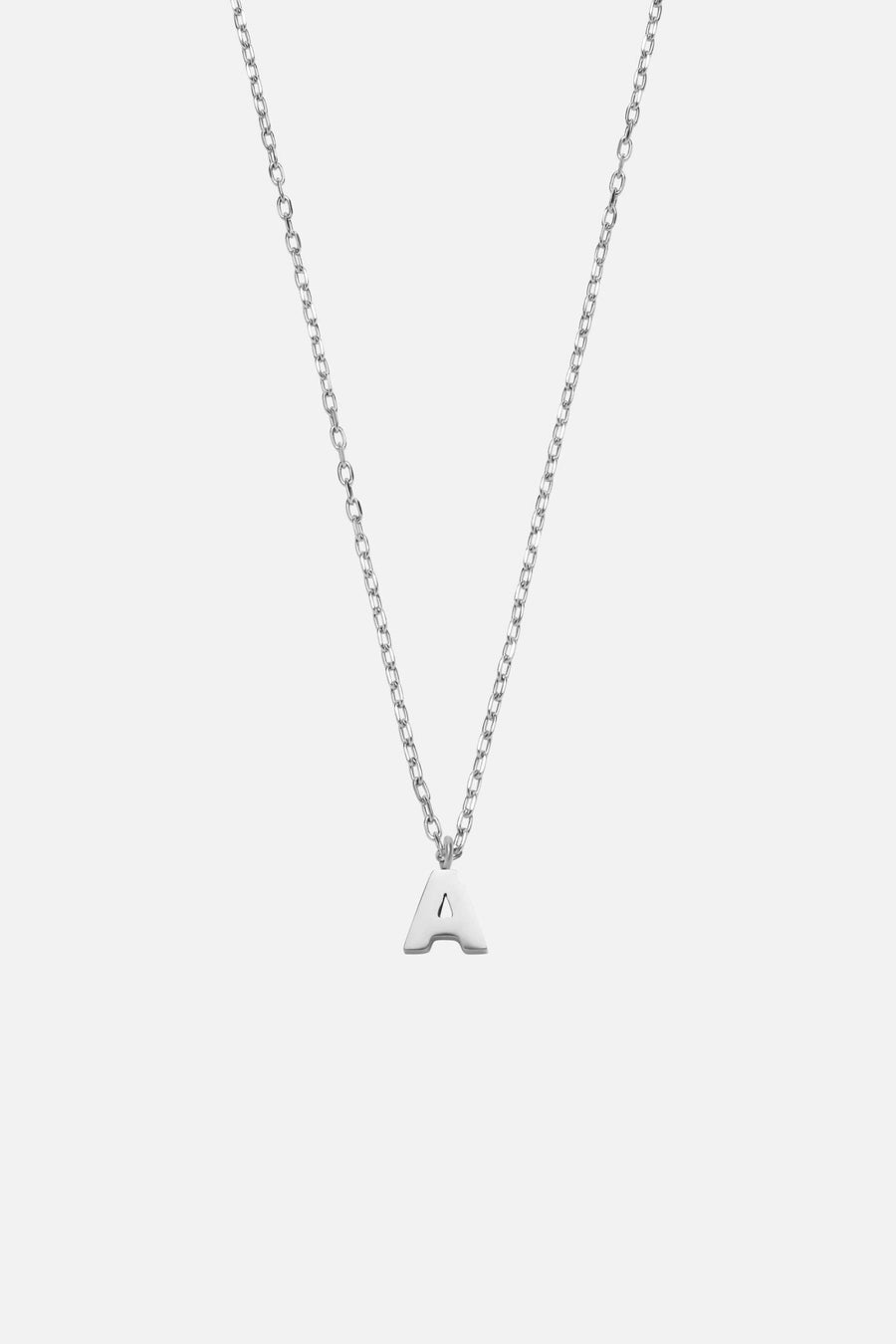 Silver-tone initial necklace, front view on a light background