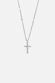 Silver-tone slim cross necklace, front view on a light background