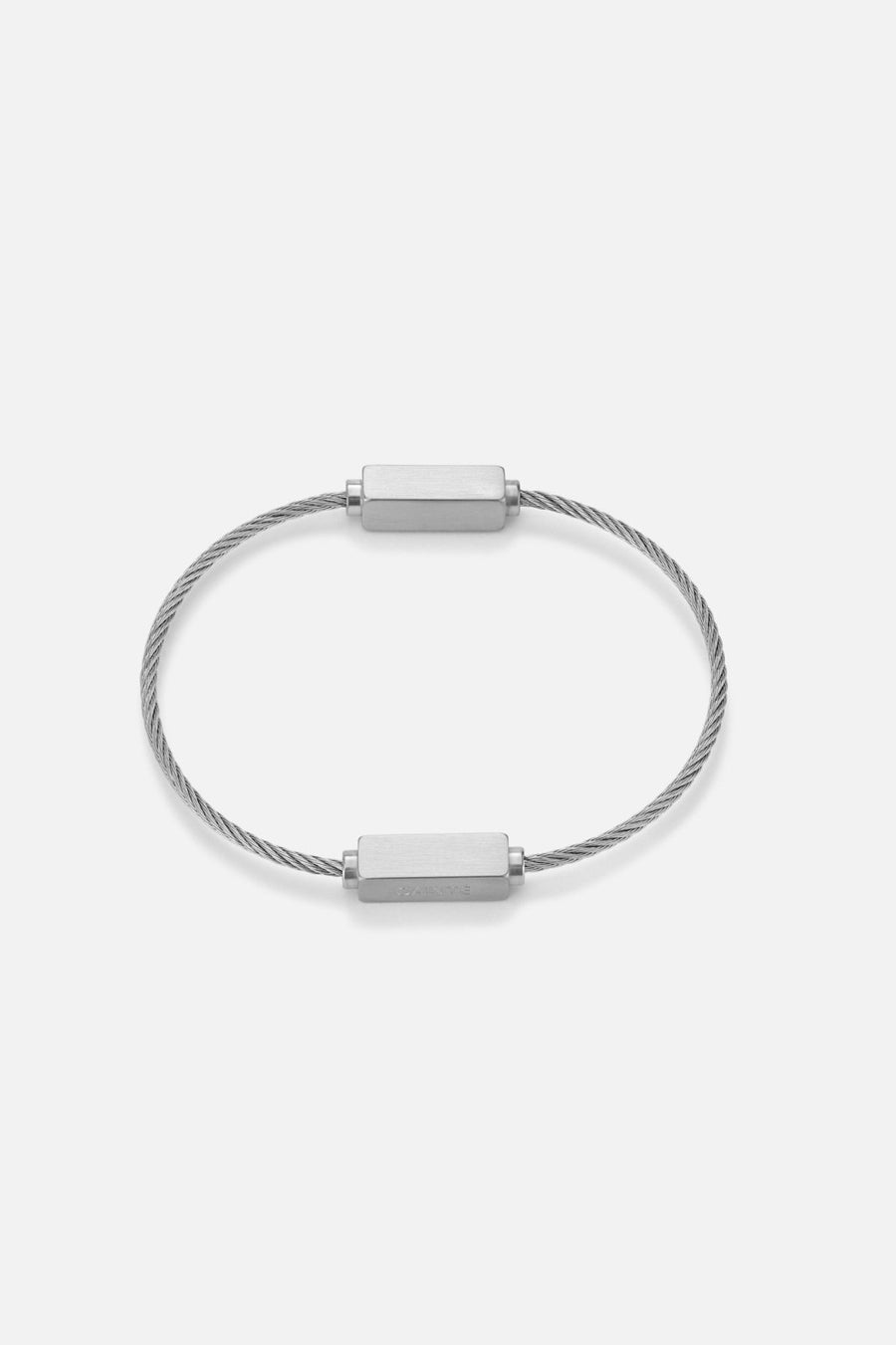 Silver-tone cable bracelet with brushed bars, front view on a light background
