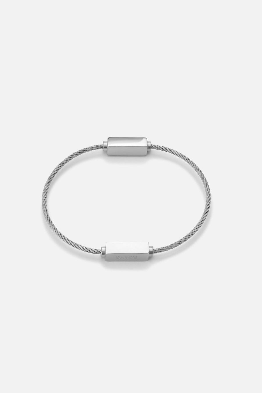 Silver-tone cable bracelet with polished bars, front view on a light background