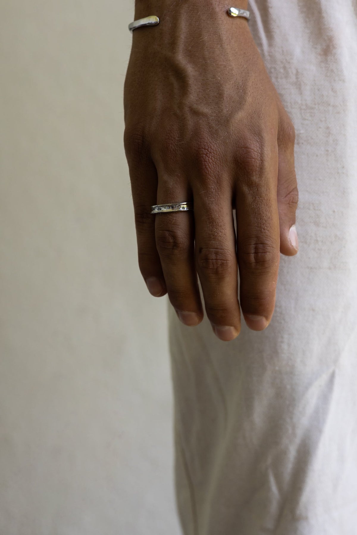 Hand wearing the band ring