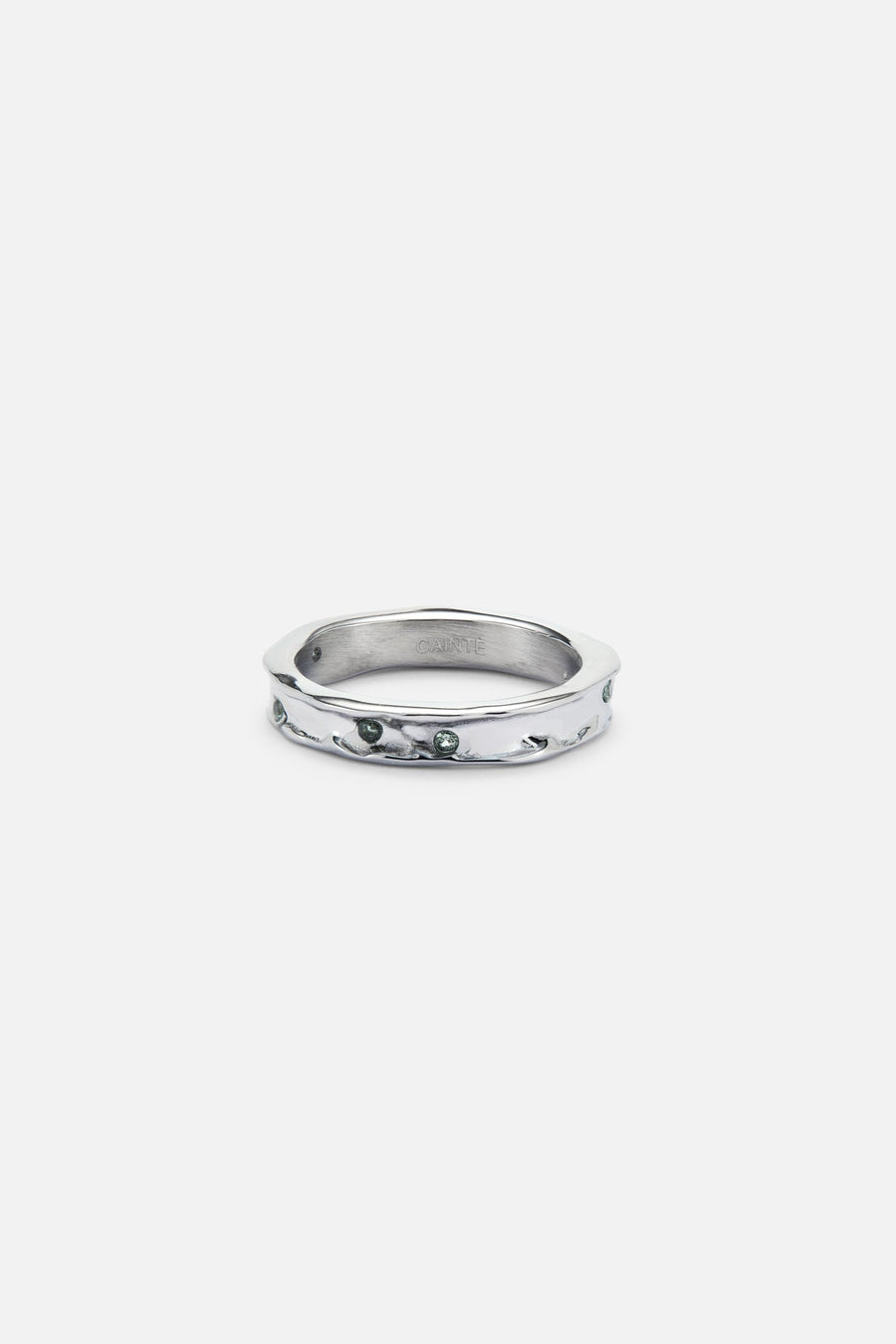 Textured band ring with small green stones, front view