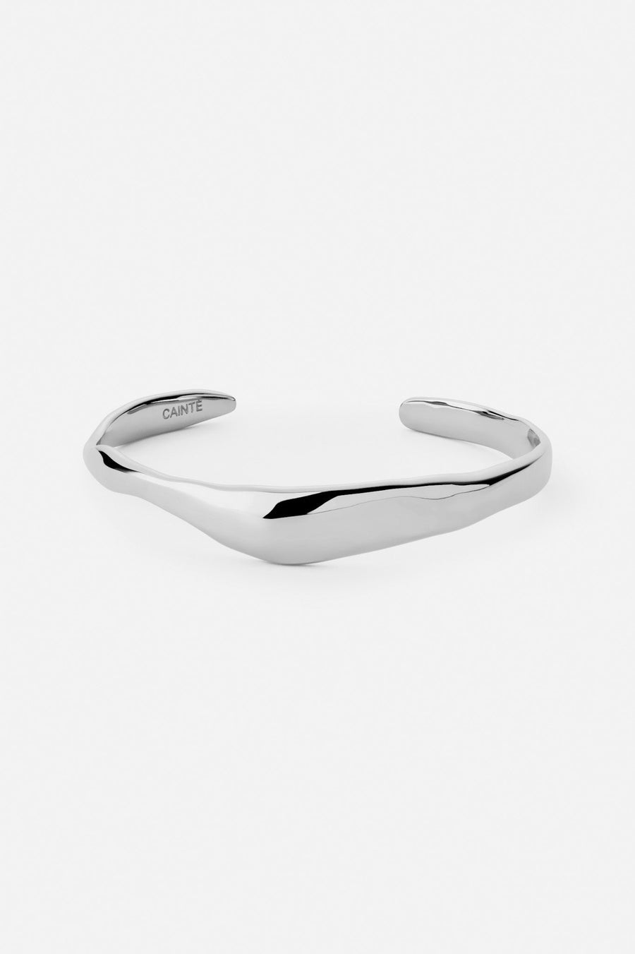 Silver-tone sculpted cuff bracelet, front view on a light background