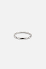Silver-tone thin band ring, front view on a light background