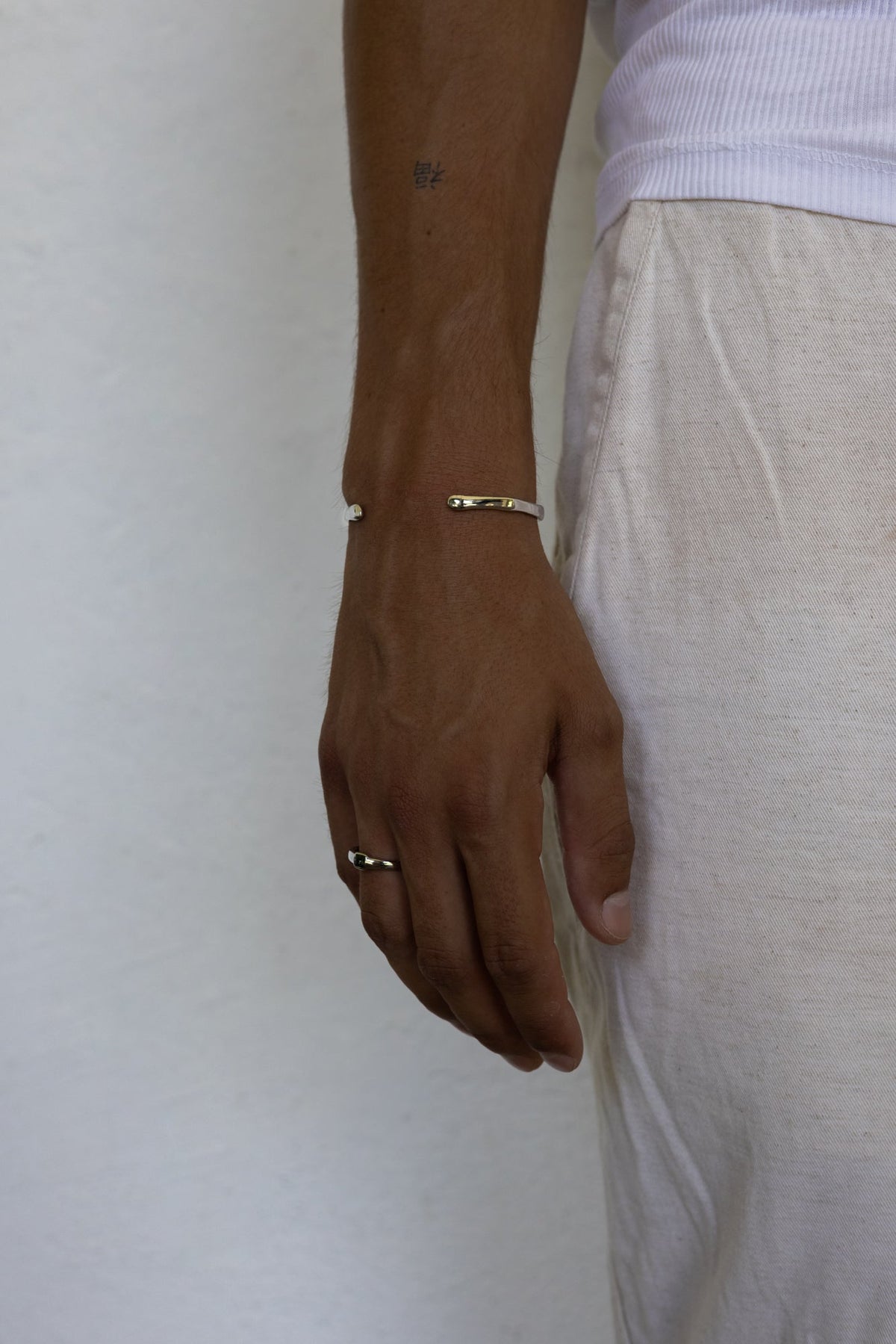 Arm and hand wearing the ring and cuff