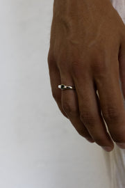 Close-up of the stone ring on the finger