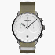 Gunmetal watch with a white dial, two subdials and an olive woven strap, front view.