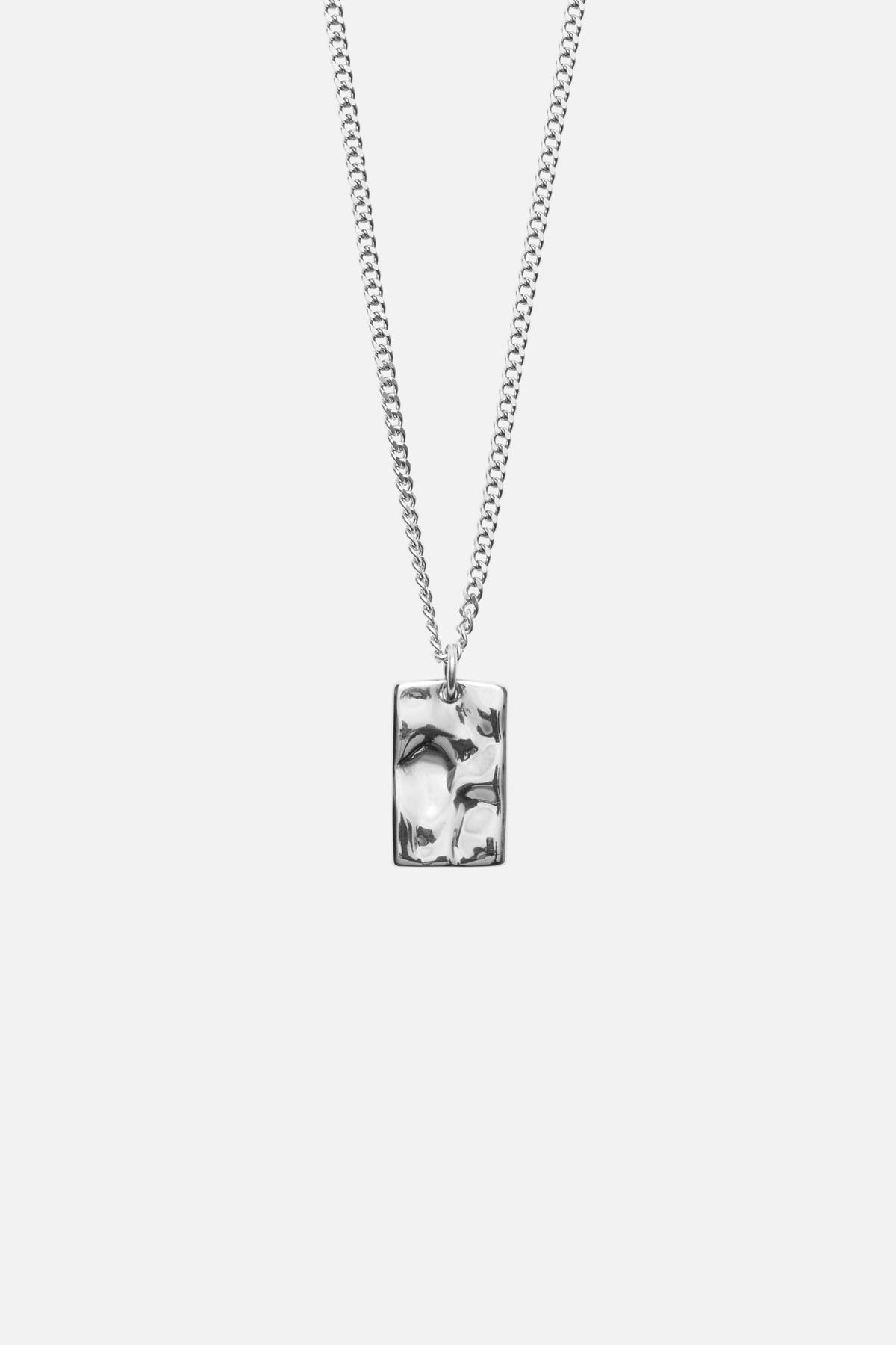 Silver-tone textured tag pendant necklace, front view on a light background