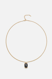 Gold-tone necklace with a black oval pendant, view 3 of 7