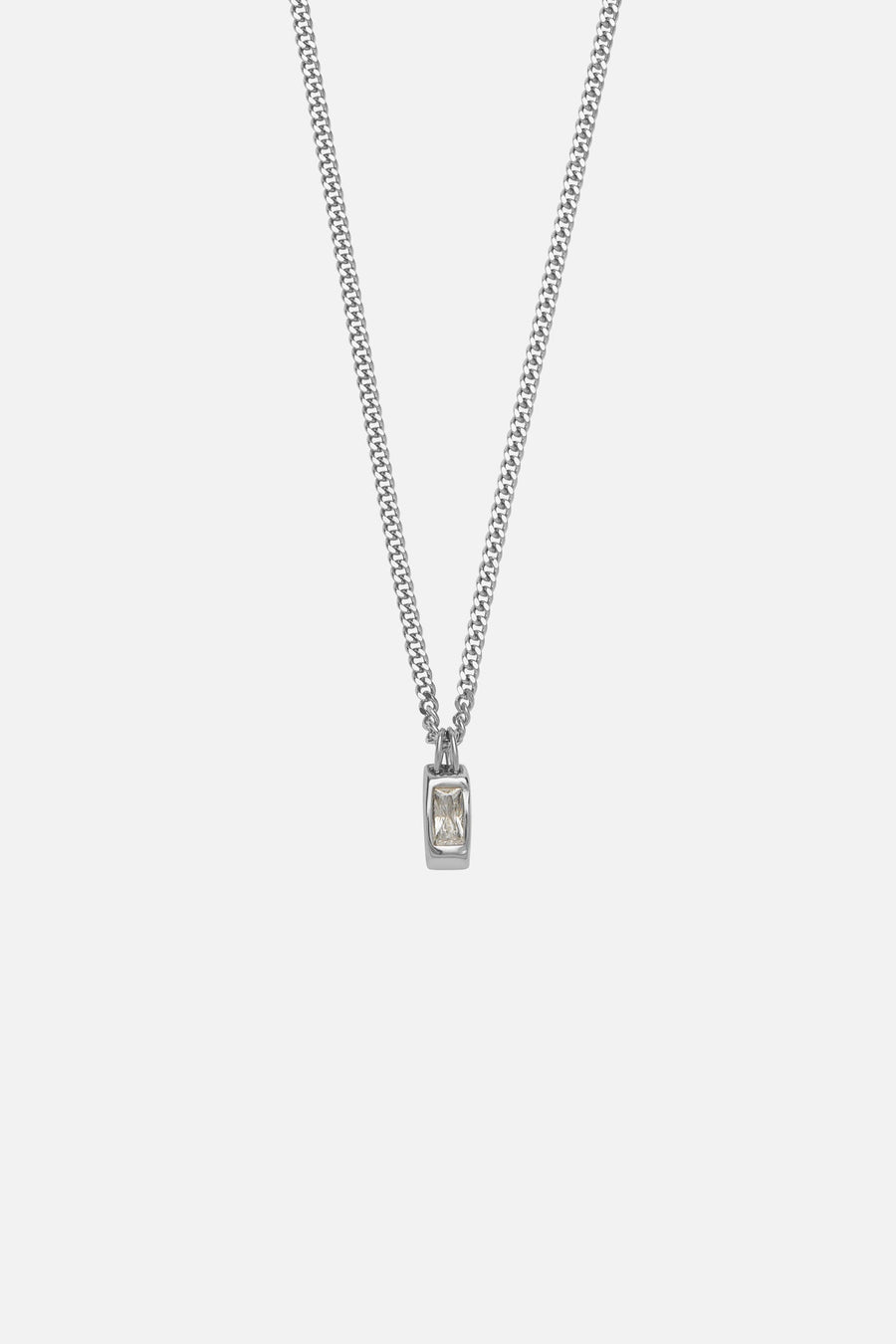 Silver-tone necklace with a small white inlay tag, front view on a light background