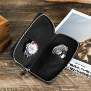 Open black case with two watches on wood