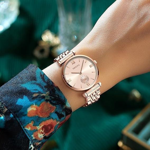 Blush dial watch on a patterned sleeve