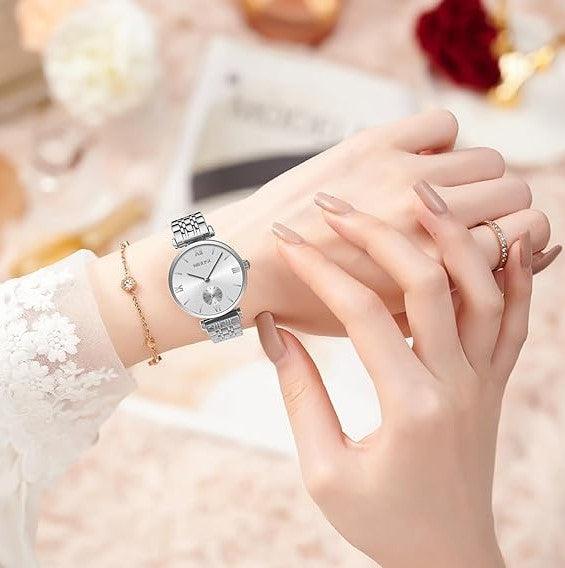 Silver watch on joined hands