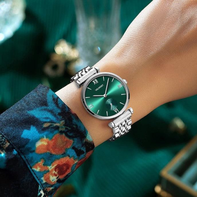 Green dial watch on a patterned sleeve
