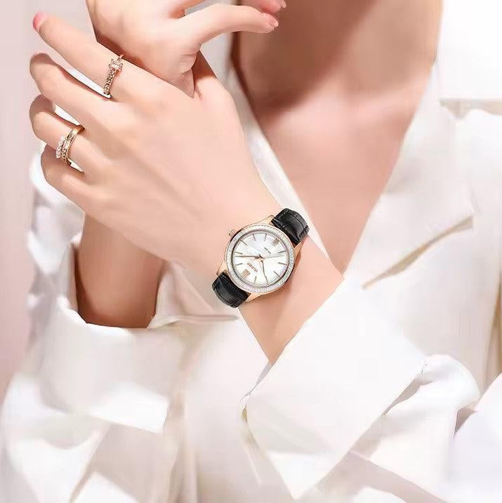 Watch worn with a white blouse