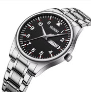 Black dial steel watch at an angle