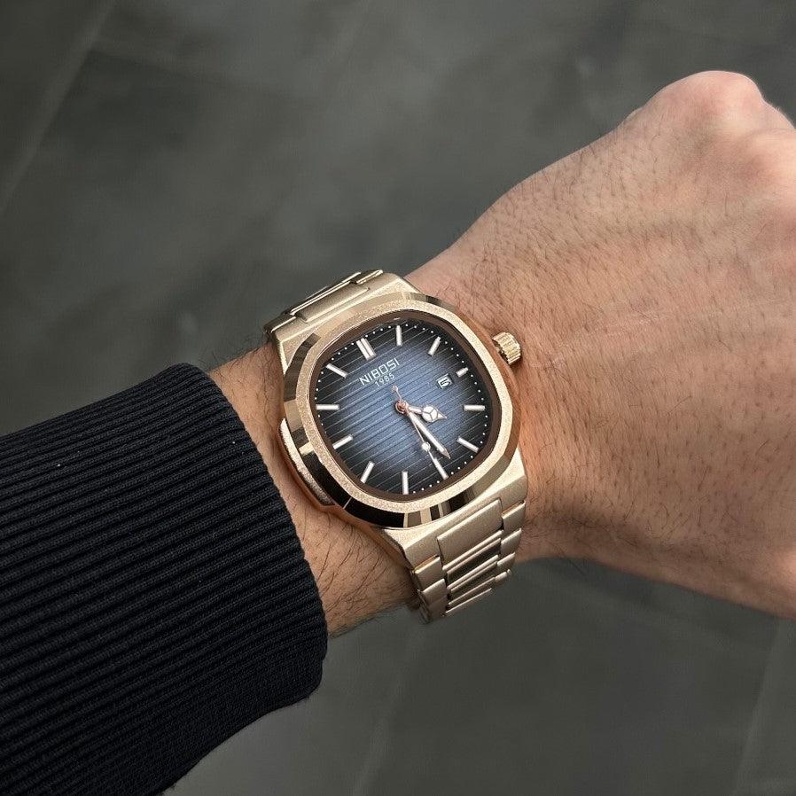 Blue dial watch on the wrist