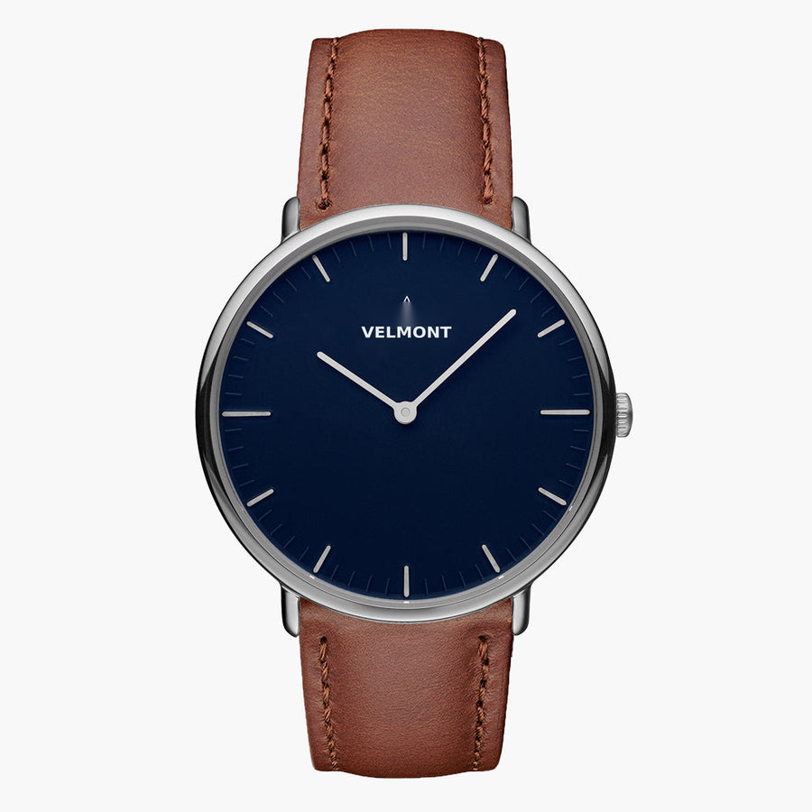 Watch with a blue sunburst dial and silver-tone case on a brown strap, shown from the front.