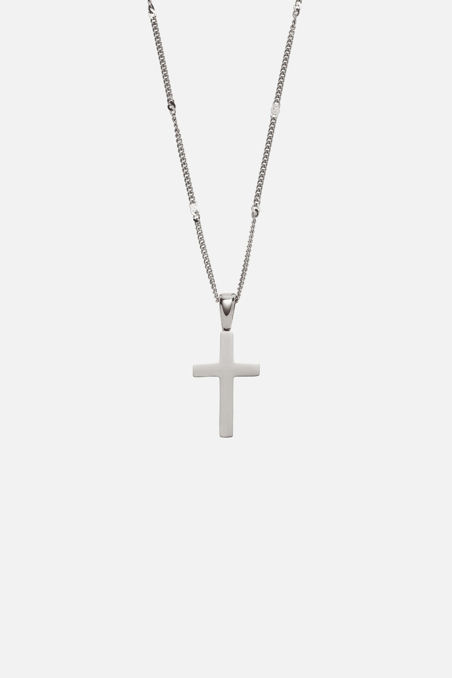Silver-tone cross pendant on a fine chain, close-up